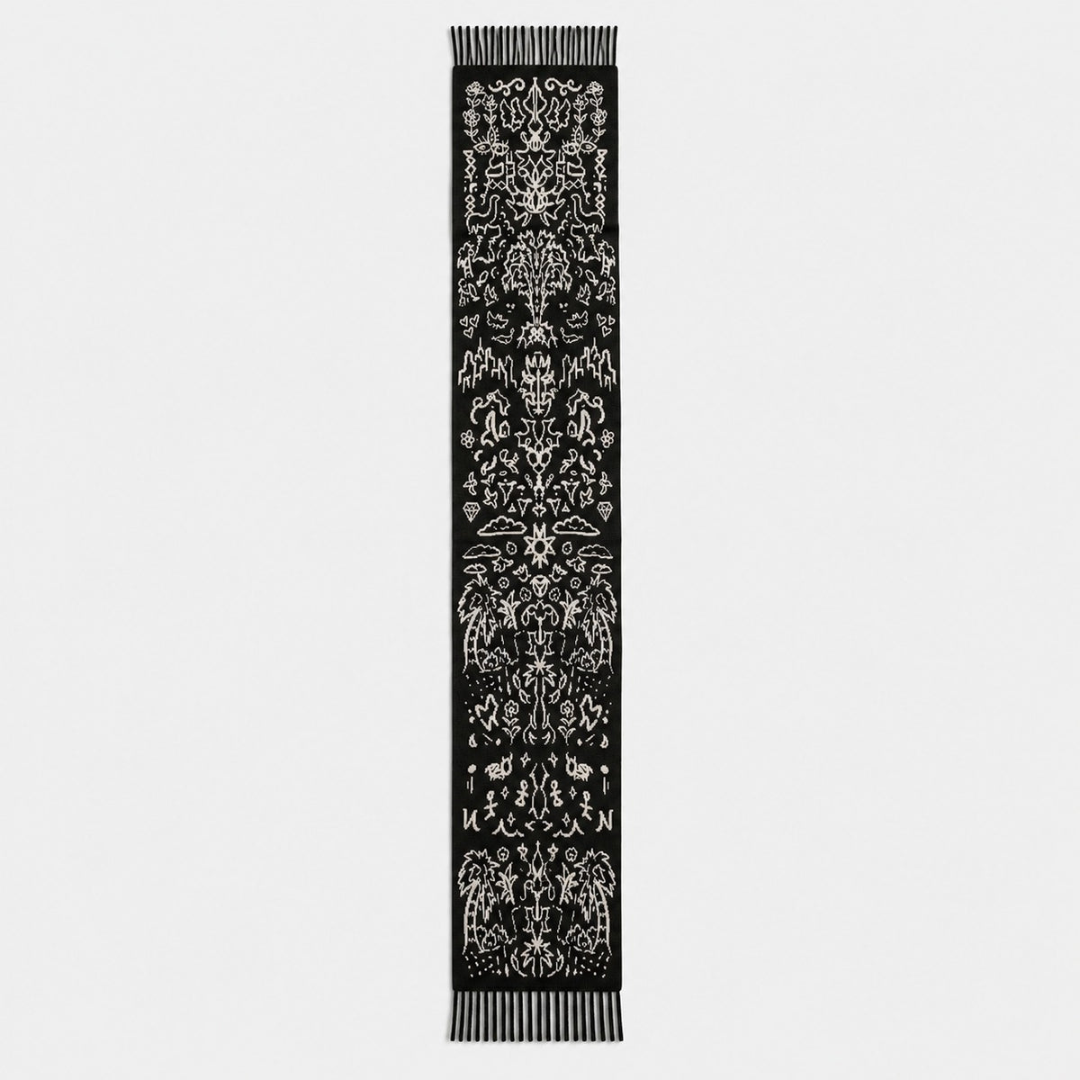 WORLDWIDE SCARF laid out full length: cities, palms, a rising sun, flowers and small figures in cream on black